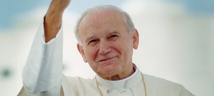 Pope John Paul II waves after arriving in Miami for his 1987 visit to United States